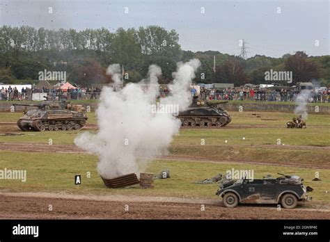 A WW2 Historical Battle Reenactment between German and American Reenactors and period Tanks ...