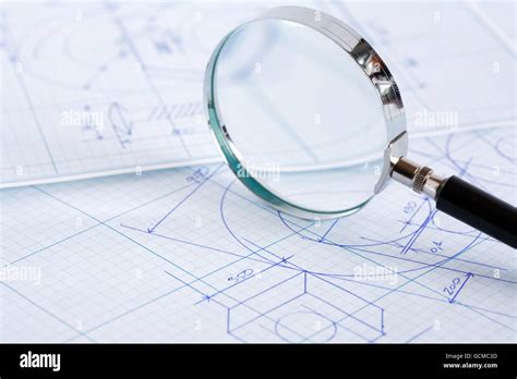 Closeup Of Magnifying Glass On Blueprint With Draft Stock Photo Alamy