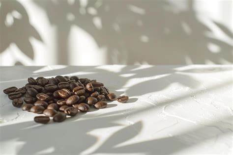 Coffee Beans on a White Table with Shadows Background 48128861 Stock
