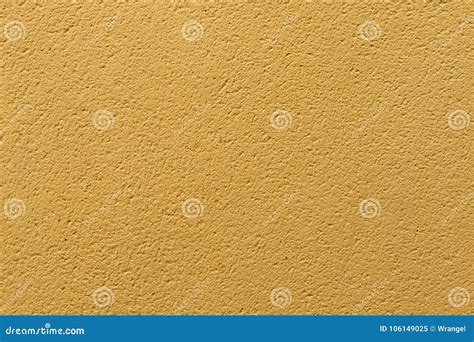 Pared Pintada Del Estuco Del Ocre Amarillo Textura Del Fondo Imagen De