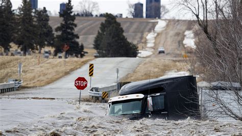 Midwest Flooding Forces Evacuations Closing Of Road River