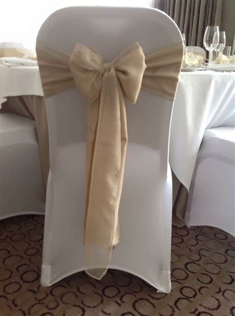 White chair covers with gold sash | Chair covers wedding, Gold chair ...