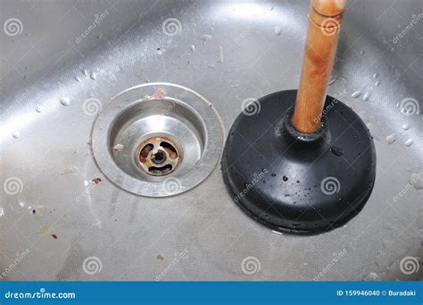 Plunger and kitchen sink stock photo. Image of faucet - 159946040