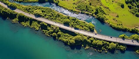 Premium Photo Aerial View On A Bridge Across A Small River On A Sunny Day