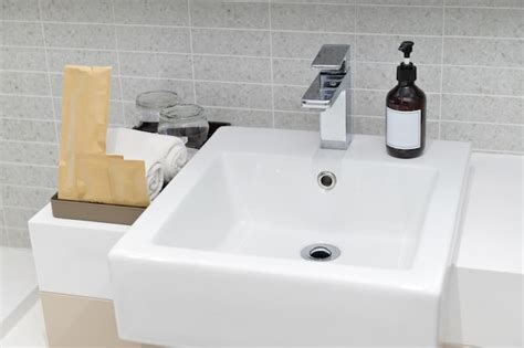 Premium Photo | Sink and faucet in white modern bathroom