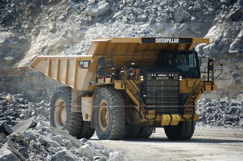 NEW CAT 777G DUMP TRUCK JUST HEAVY EQUIPMENT