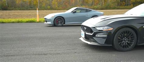 A Nissan Z And Ford Mustang Gt Go Head To Head In A Drag Race