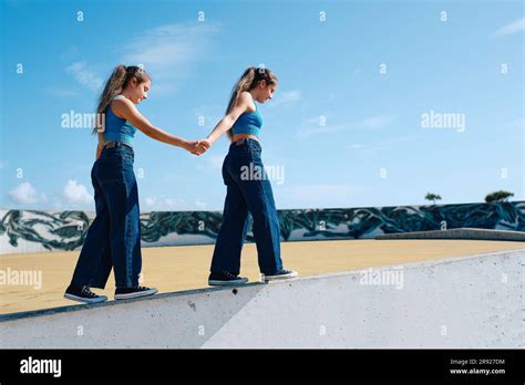 Twin Sisters Holding Hands Hi Res Stock Photography And Images Alamy