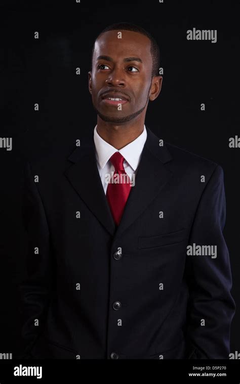 Black Man In Dark Suit White Shirt And Red Tie A Successful