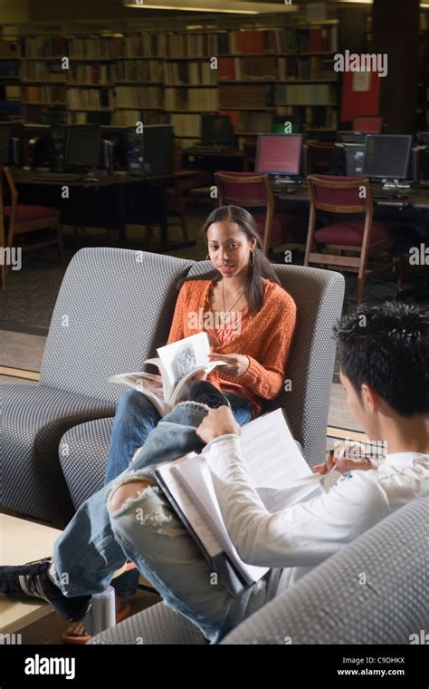 Students In Library Sitting On Chairs Studying Stock Photo Alamy