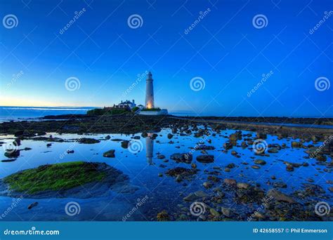 St Mary S Lighthouse at Sunset Stock Image - Image of storm, rocks ...