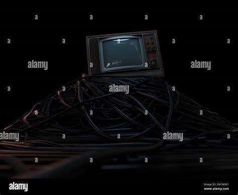 A Vintage 80s Television Perched On A Jumbled Pile Of Black Cables On