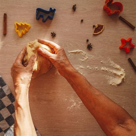 Premium Photo Cropped Hands Of Woman Kneading Dough On Table