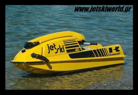 A Yellow Jet Ski In The Water With Its Front End Out And It S Wheels