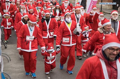 Thousands Dress Up To Take Part In Annual Santa Run In Central Budapest