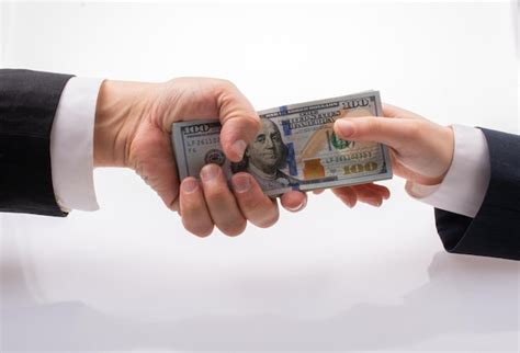 Premium Photo Businessman Giving And Receiving Dollar Banknote Money