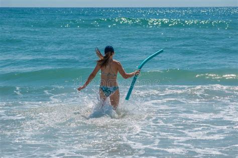 Girl with Foam Pool Enjoying the Waves at Main Street Pier Area. 2 Editorial Stock Image - Image ...