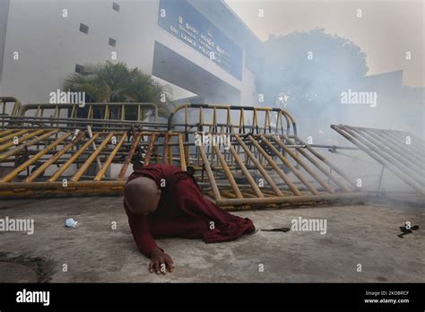 A Sri Lankan Buddhist Nun Bhikkhuni Falls On The Ground In Front Of