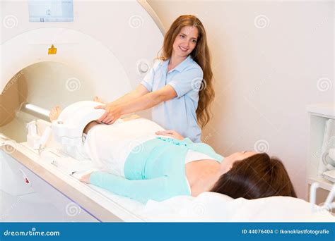 medical technical assistant preparing scan  knee  mri stock photo