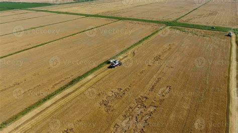 Harvesting barley harvesters. Fields of wheat and barley, the work of ...