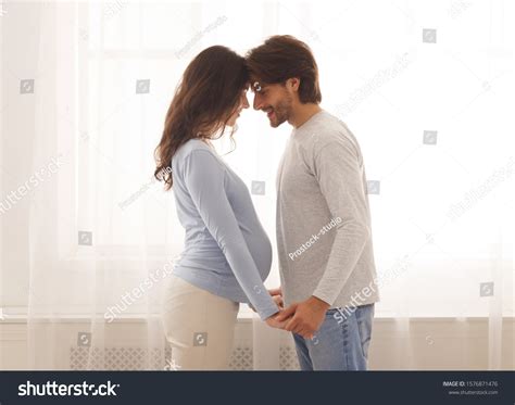 Romantic Couple Expecting Baby Holding Hands Stock Photo 1576871476 ...