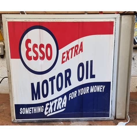 An Esso Extra Motor Oil Perspex Double Sided Wall Mounted Illuminated