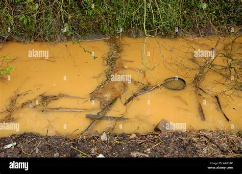 Discolored Stream Running Out Of Brofiscin Quarry Toxic Waste Was