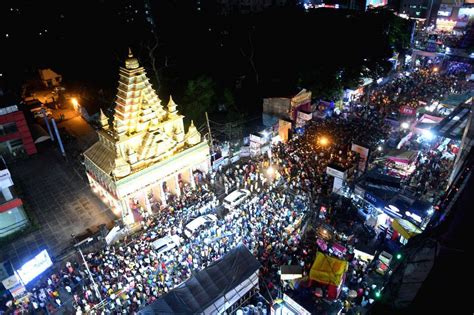 People gather at a 'puja pandal' during 'Maha Navami' of Durga Puja celebrations