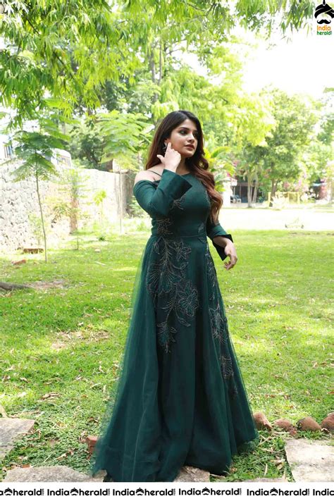 Aathmika Hot Photoshoot Stills In Dark Green Attire Set