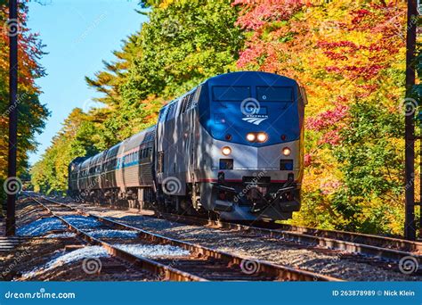 Amtrak Train Going Through Forest During Fall Foliage In Maine