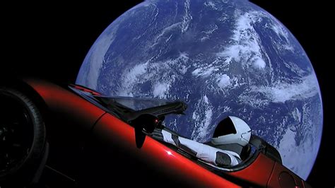 Elon Musk's Tesla Roadster leaving Earth's orbit. : pics