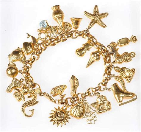 9ct Gold Charm Bracelet With 27 Assorted Charms