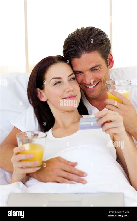 Intimate Couple Drinking Orange Juice Stock Photo Alamy