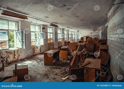 Obsolete Room Interior With Old Broken Wooden Furniture On Old