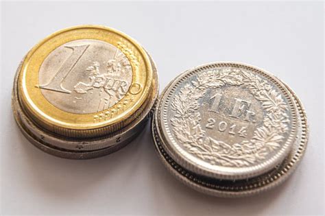 Coins of Euro and Swiss Franc. Conversion between Euro and CHF Stock Photo - Image of investment ...