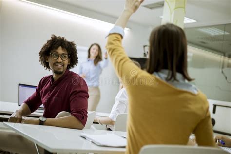 Students in a Classroom - Rising Hand Stock Image - Image of smiling ...