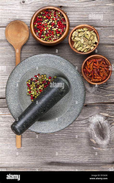 Mortar and pestle with fresh spices Stock Photo - Alamy