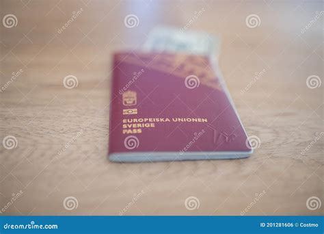 Sweden Passport with a Blurry Twenty Thai Baht Bill Partially Inside ...