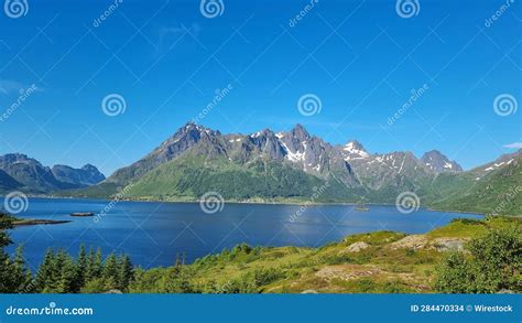 View Of Austvagsoya Norway Featuring A Large Body Of Water Surrounded