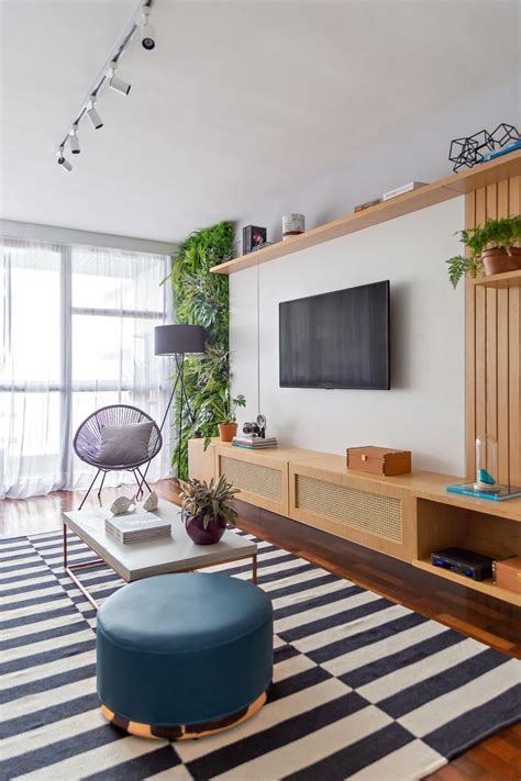 The Living Room Is Decorated With Plants And Modern Furniture