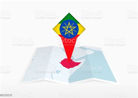 Vetores De A Etiópia É Retratada Em Um Mapa De Papel Dobrado E Marcador De Localização Fixado