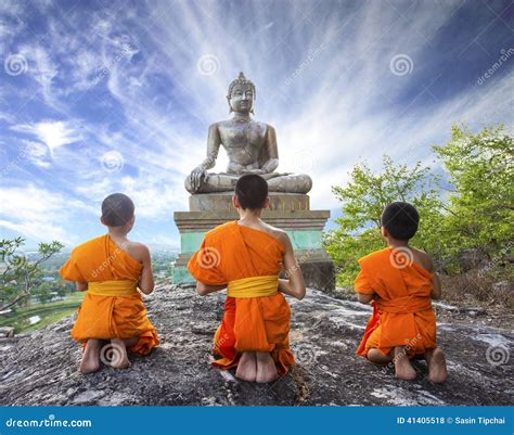 Novice Monk Praying To The Buddha In Phrabuddhachay Temple Editorial