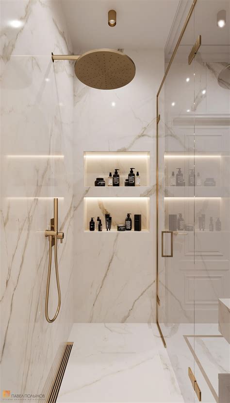 A Bathroom With White Marble Walls And Flooring Including A Walk In