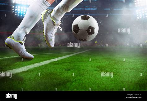 Football Scene At Night Match With Close Up Of A Soccer Player Running