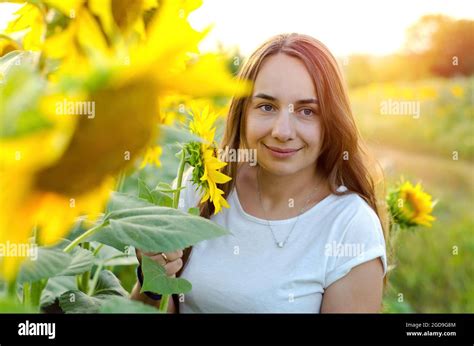 Beautiful Woman In Sunflowers Field Stock Photo Alamy