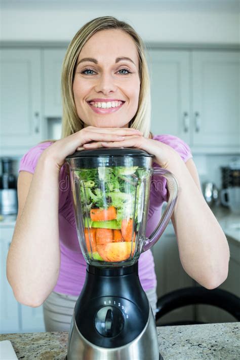 Pretty Blonde Woman Preparing A Smoothie Stock Photo Image Of