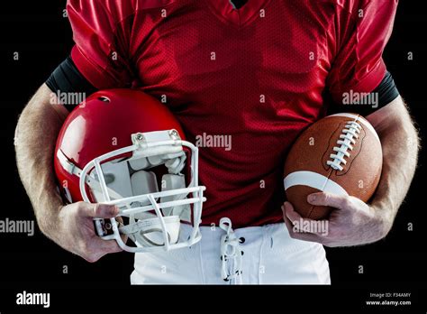 American Football Player Holding Helmet Stock Photo Alamy