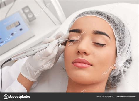 Young Woman Undergoing Procedure Permanent Eye Makeup Tattoo Salon