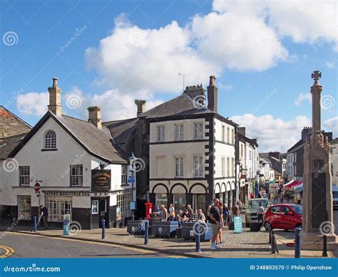 View Of The Town Centre In Ulverston Cumbria With People Walking Past