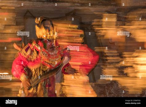 Dramatic photo of colorfully dressed Kecak dancers dressed in ...